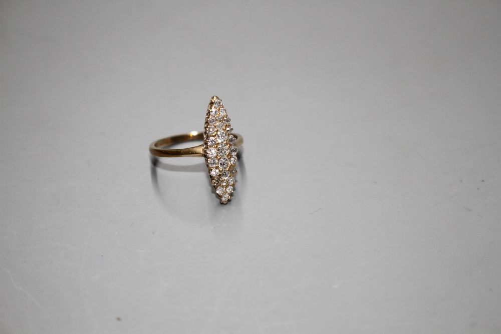 A yellow metal (tests as 18ct) and old round cut diamond set marquise cluster ring,